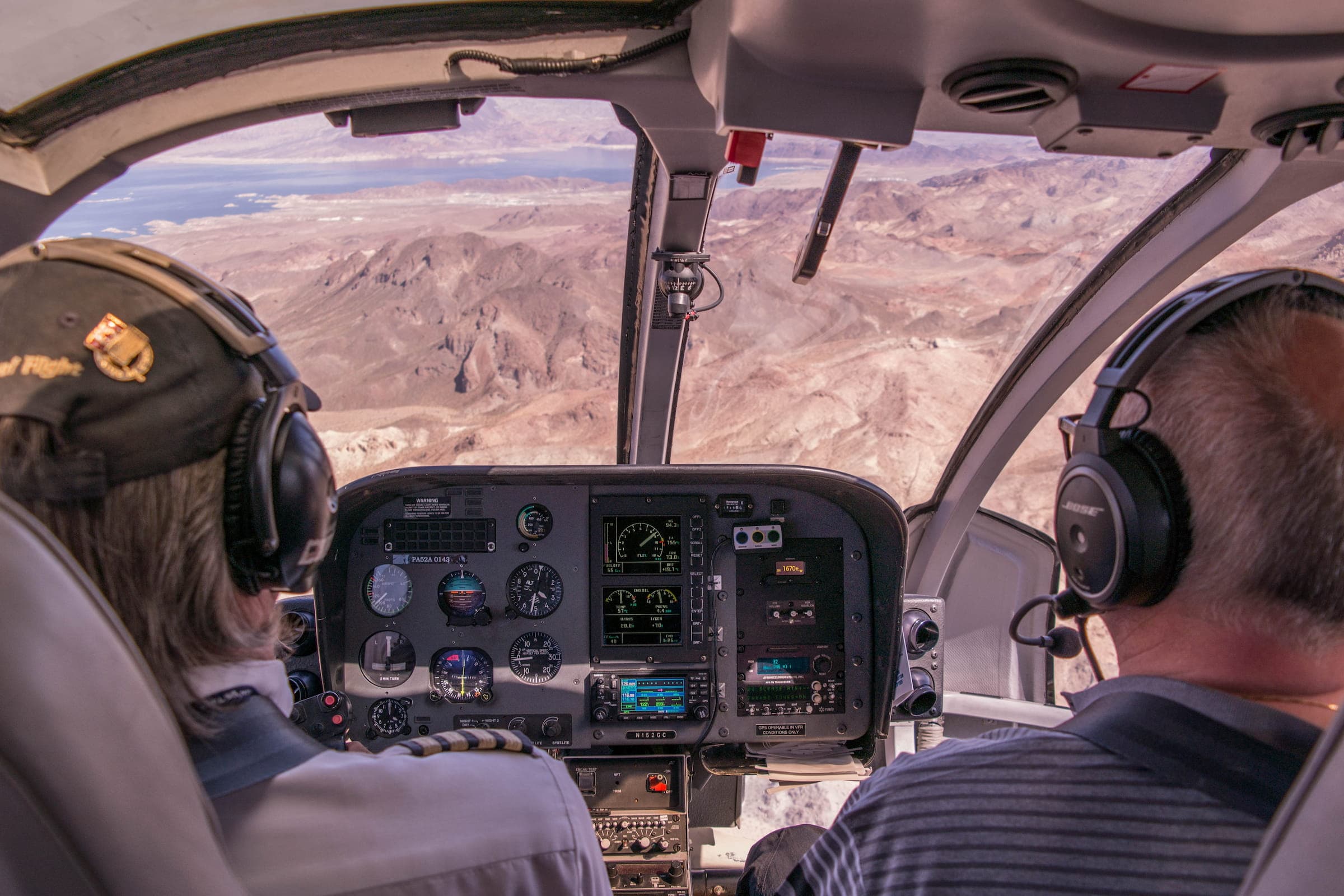 A pilot in a cockpit representing navigating complex tool decisions